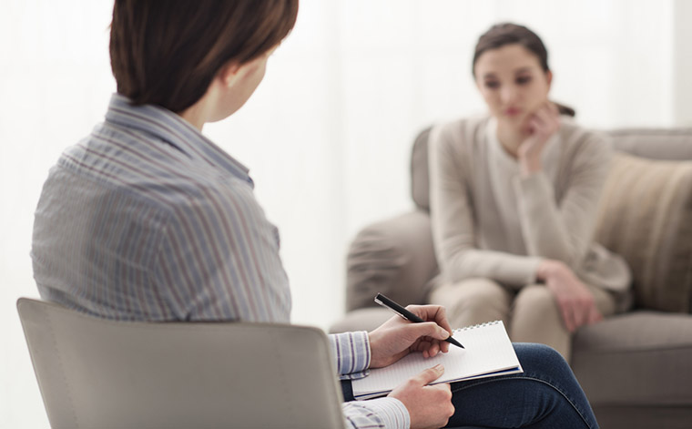 Image of a therapist and a client, protect your business with Selective
